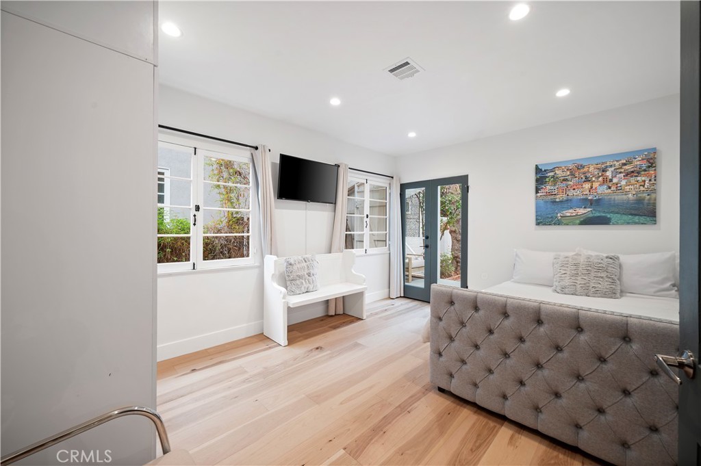 11305 Valley Spring Lane Studio City, CA 91602 - Photo 40 of 50 a bedroom with furniture and window