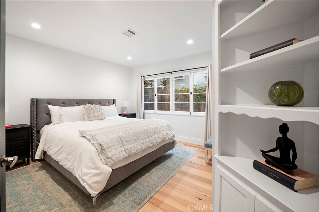 11305 Valley Spring Lane Studio City, CA 91602 - Photo 42 of 50 a bedroom with a large bed and a window
