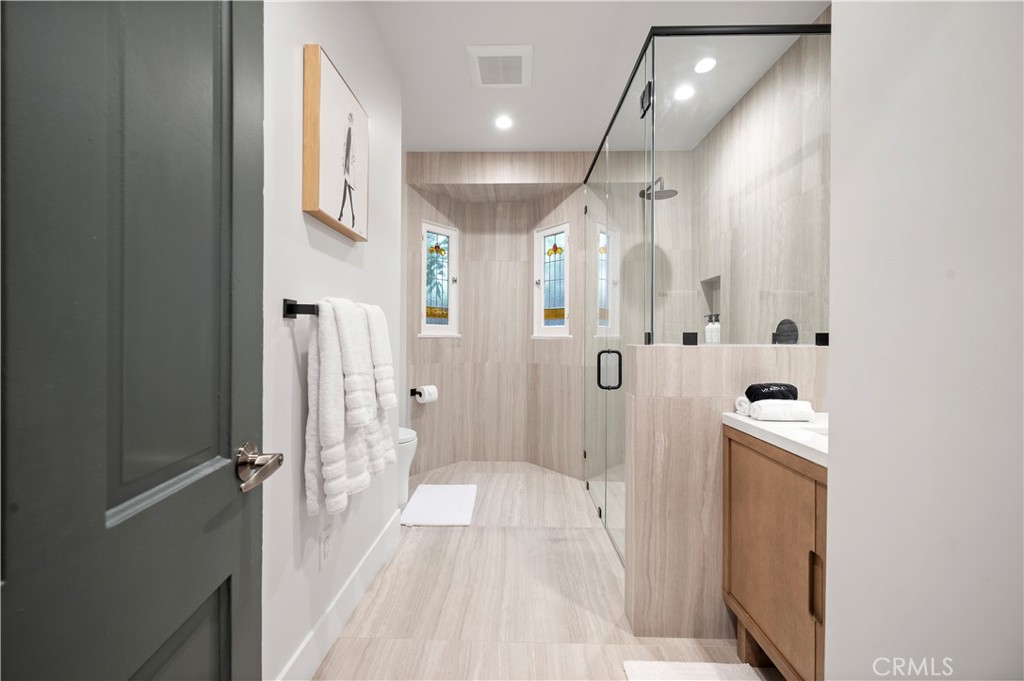 11305 Valley Spring Lane Studio City, CA 91602 - Photo 44 of 50 a bathroom with a bathtub and a shower