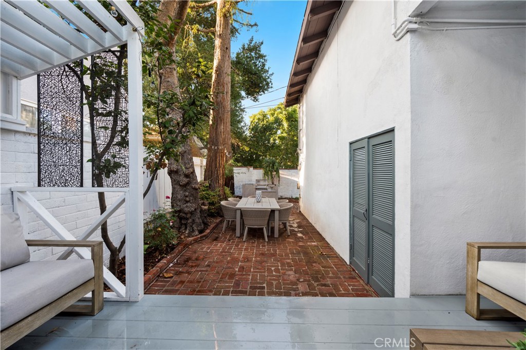 11305 Valley Spring Lane Studio City, CA 91602 - Photo 47 of 50 a view of a patio with chair and tables