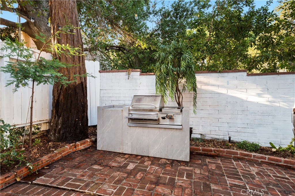 11305 Valley Spring Lane Studio City, CA 91602 - Photo 48 of 50 a white bench sitting in middle of a room