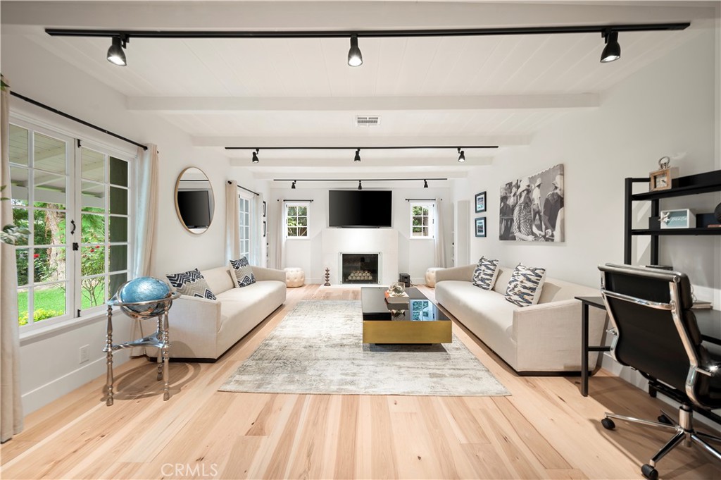 11305 Valley Spring Lane Studio City, CA 91602 - Photo 5 of 50 a living room with furniture and a fireplace
