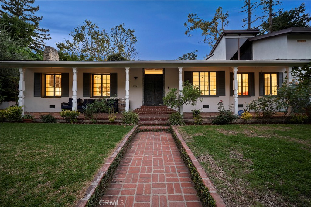 11305 Valley Spring Lane Studio City, CA 91602 - Photo 7 of 50 front view of a house with a yard