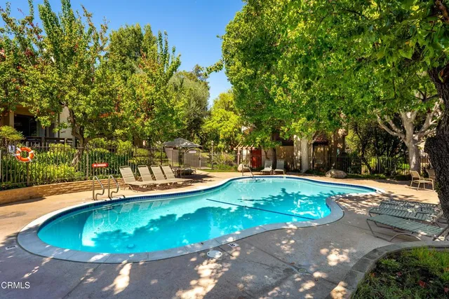 a view of a swimming pool with an outdoor space