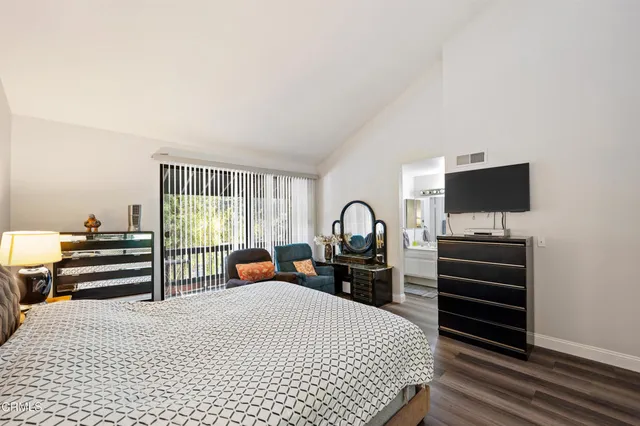 a bedroom with a bed and furniture