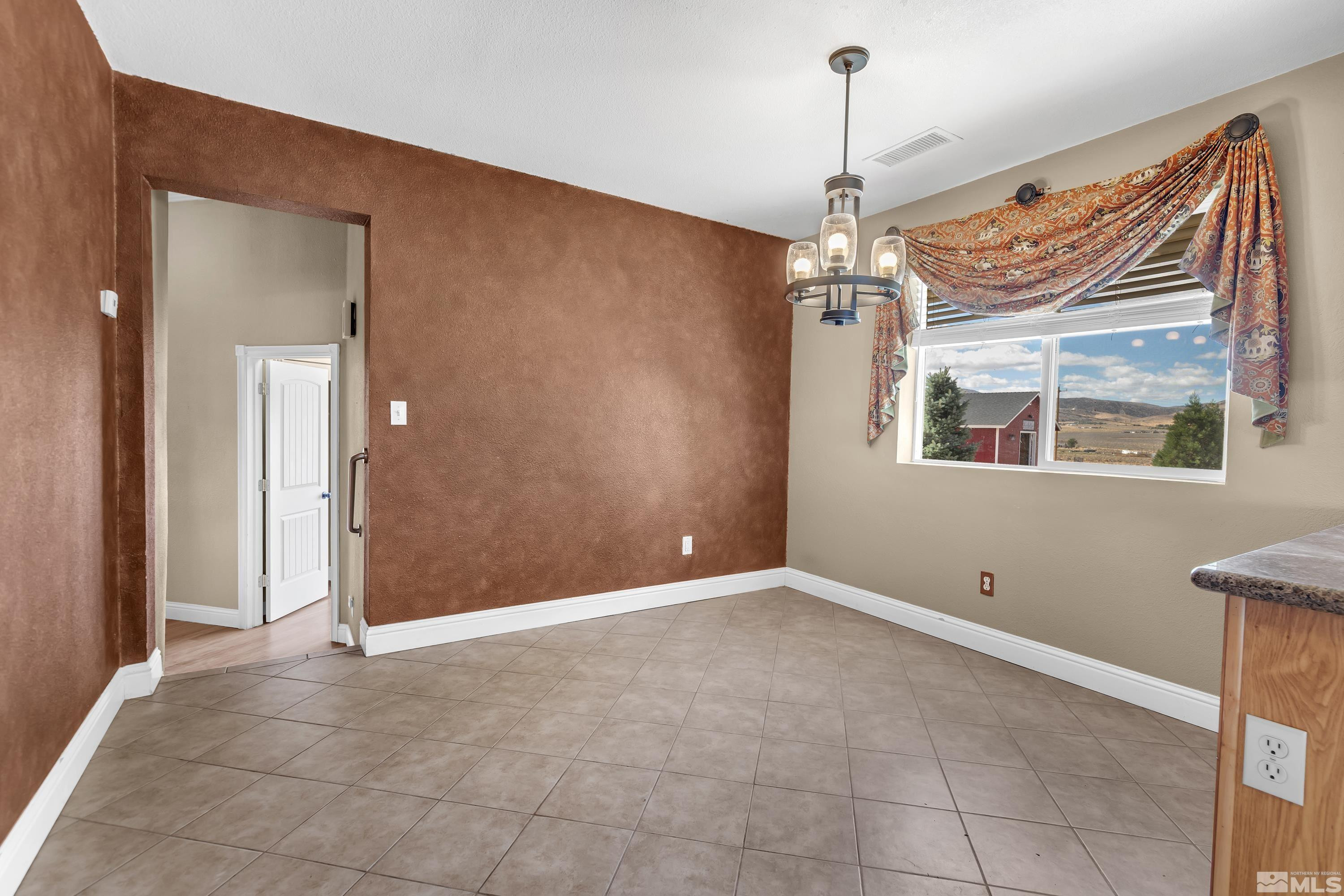 4600 Pasture View Road Reno, NV 89510 - Photo 22 of 40 a view of an empty room with a window