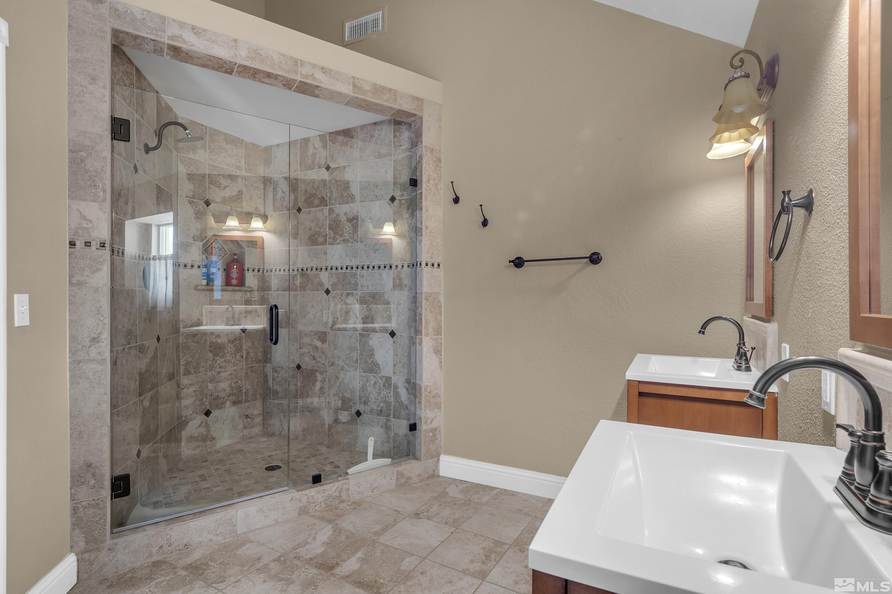 4600 Pasture View Road Reno, NV 89510 - Photo 33 of 40 a bathroom with a sink and shower