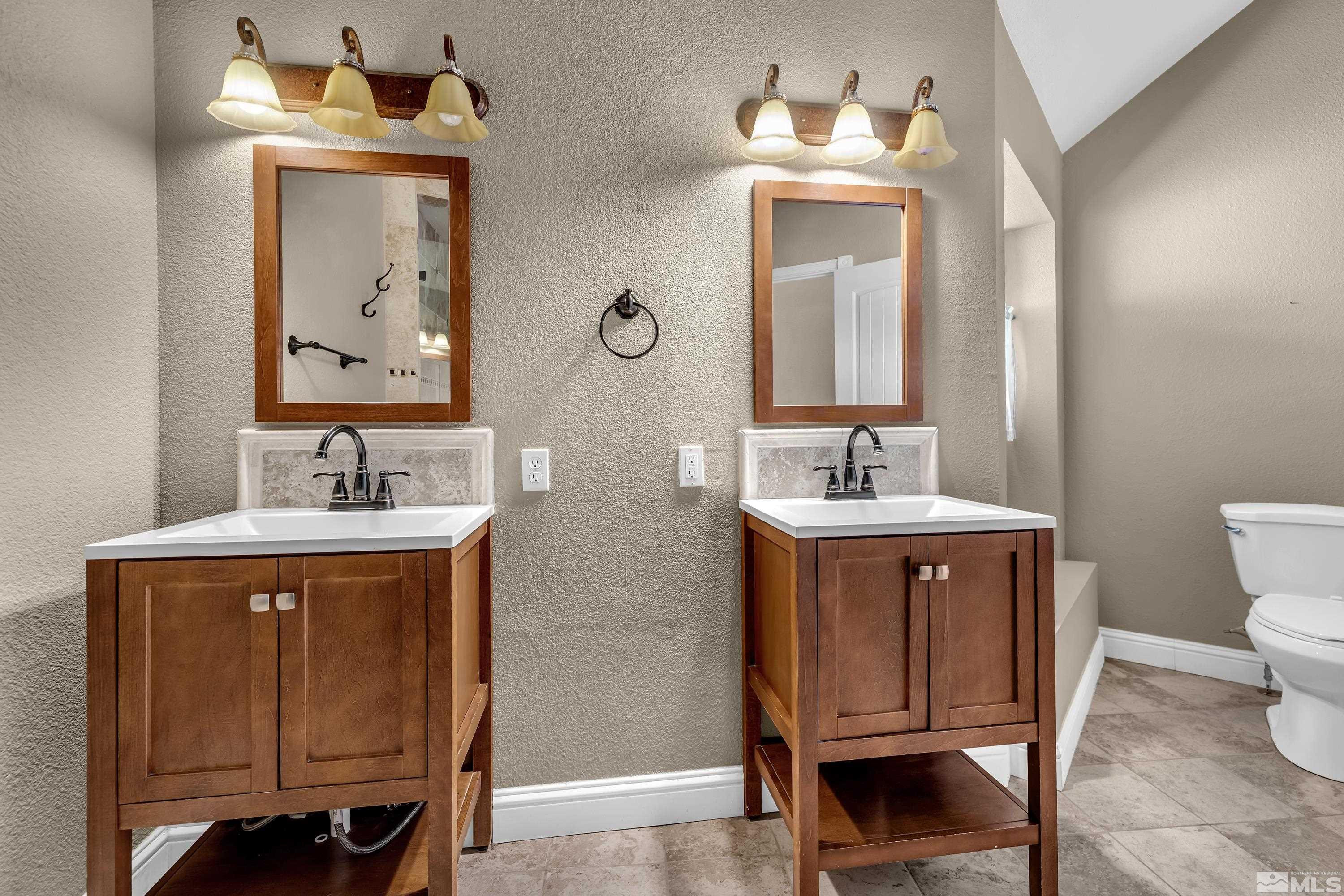 4600 Pasture View Road Reno, NV 89510 - Photo 34 of 40 a bathroom with a sink and a mirror
