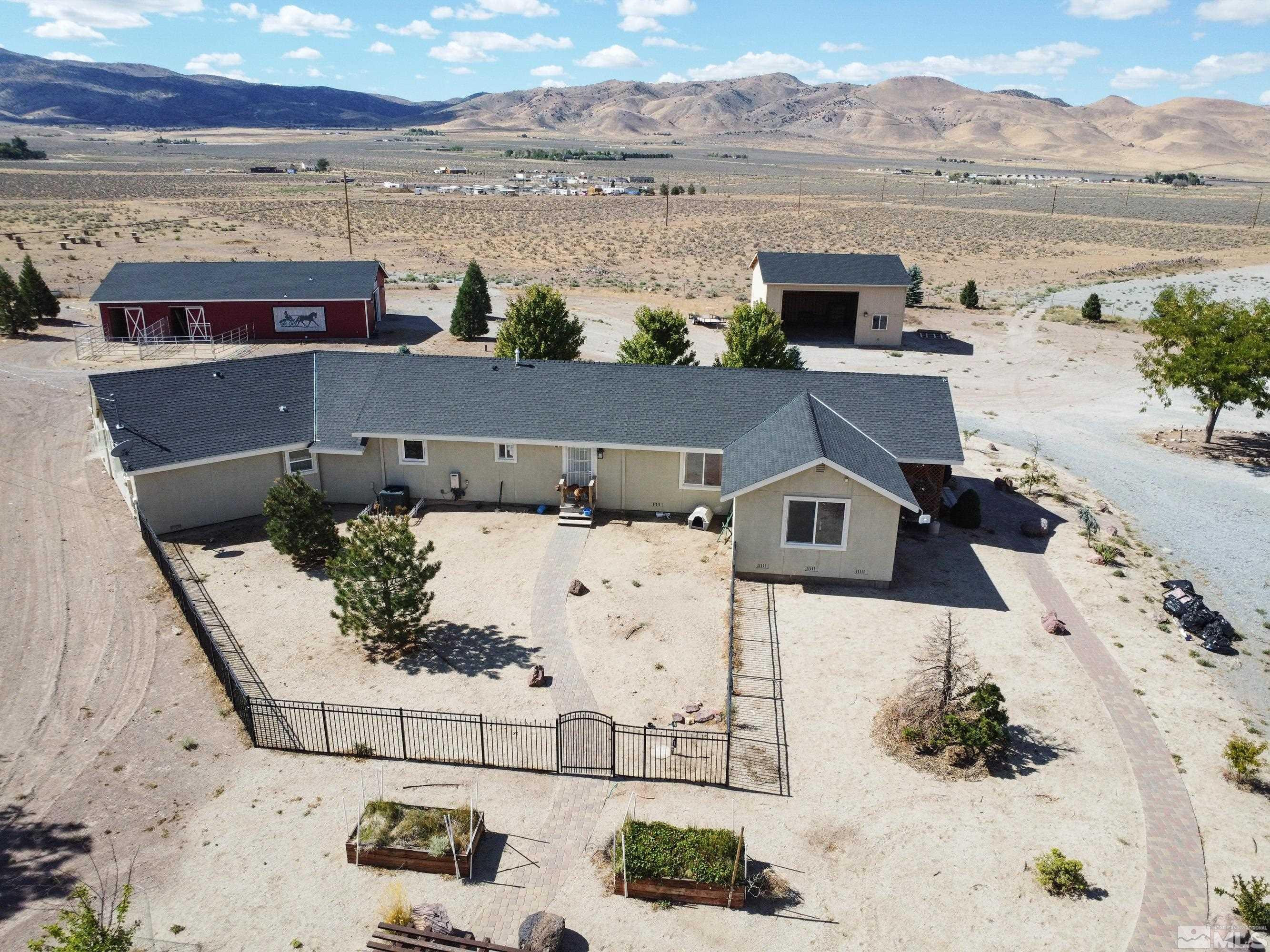 4600 Pasture View Road Reno, NV 89510 - Photo 4 of 40 a view of a lake with a mountain in the background