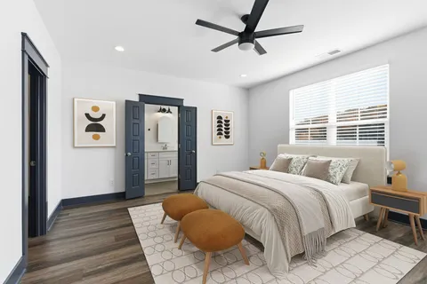 a bedroom with a bed and wooden floor