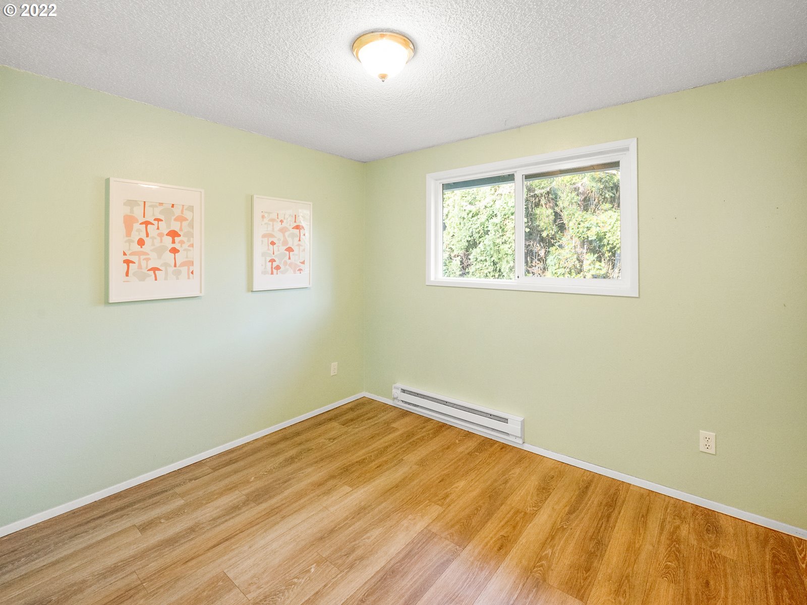 8810 Southeast Rural Street Portland, OR 97266 - Photo 12 of 32 a view of room with wooden floor