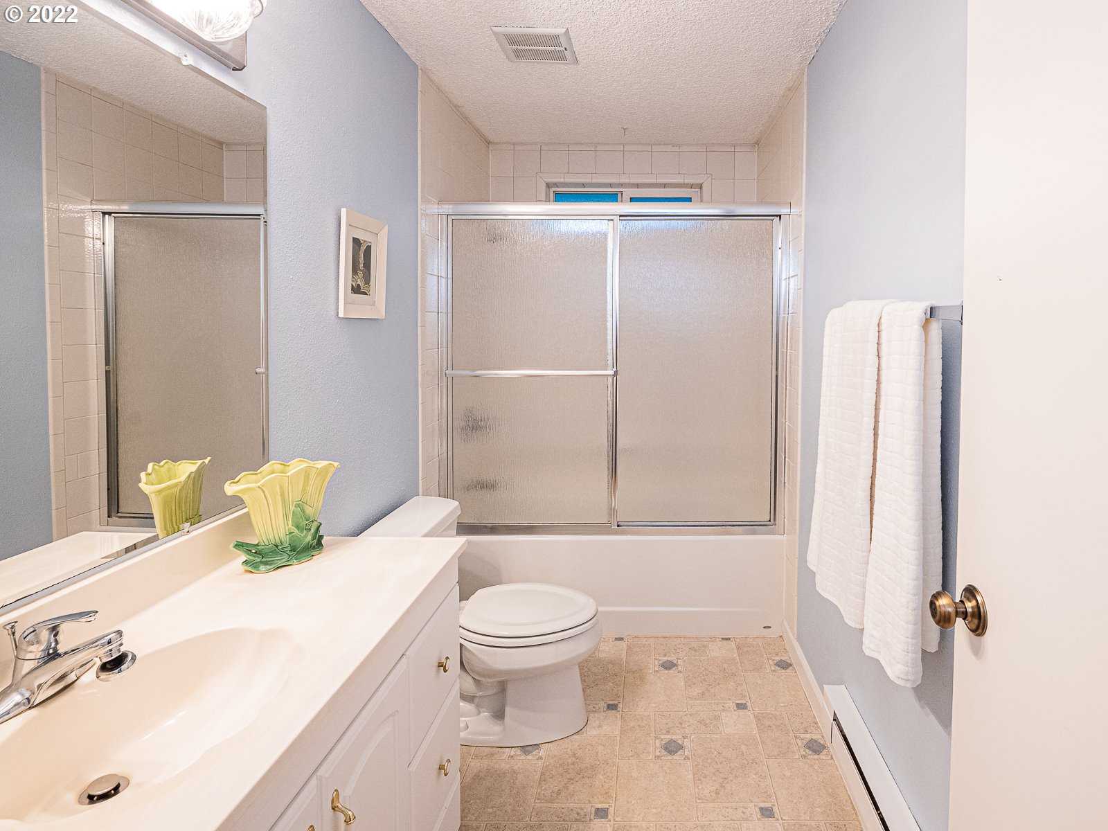8810 Southeast Rural Street Portland, OR 97266 - Photo 16 of 32 a bathroom with a sink toilet and shower