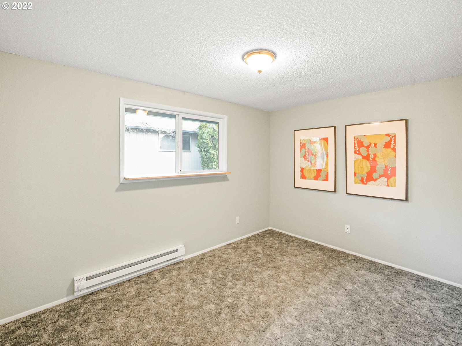 8810 Southeast Rural Street Portland, OR 97266 - Photo 17 of 32 an empty room with windows