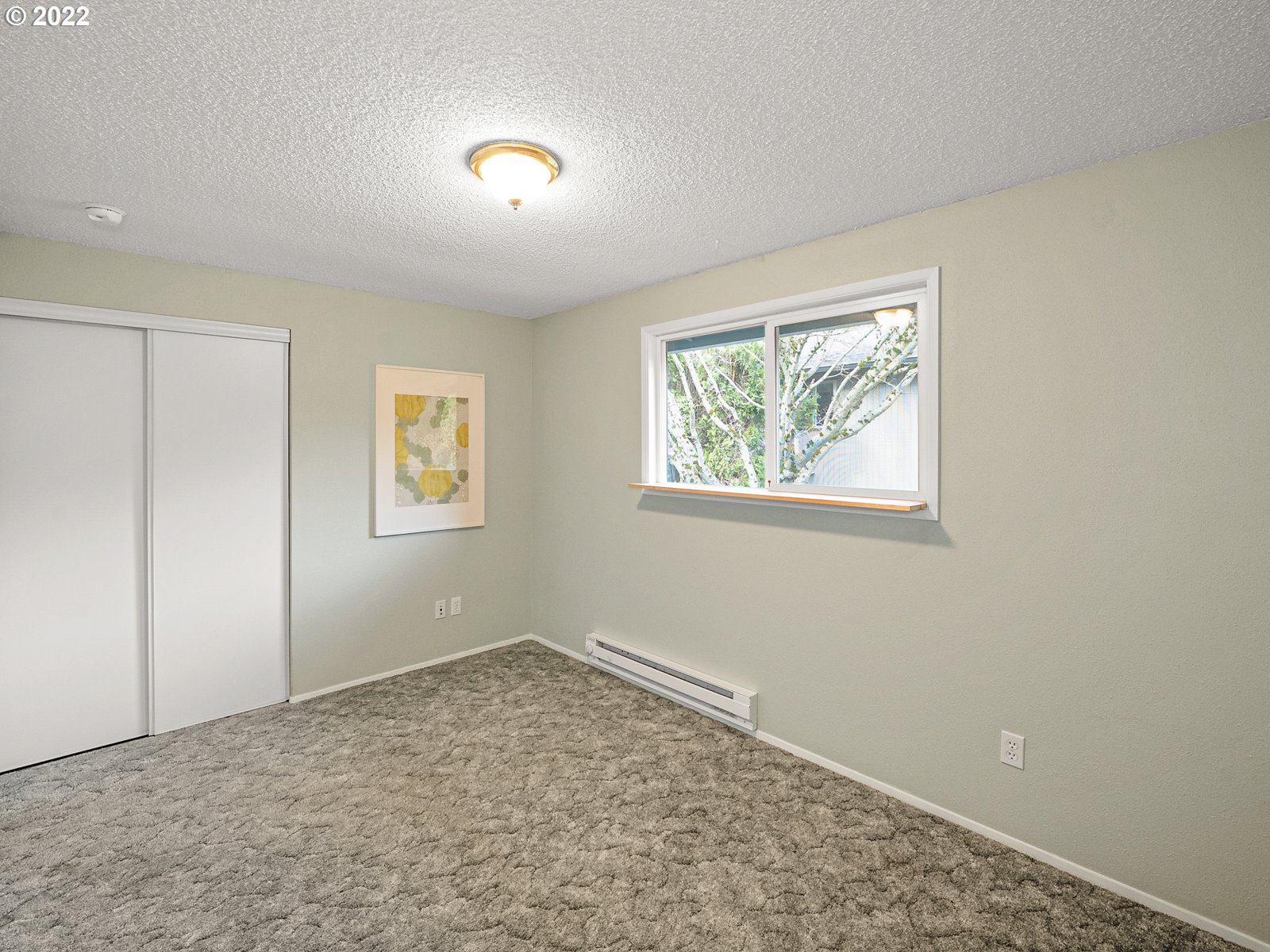 8810 Southeast Rural Street Portland, OR 97266 - Photo 18 of 32 an empty room with windows