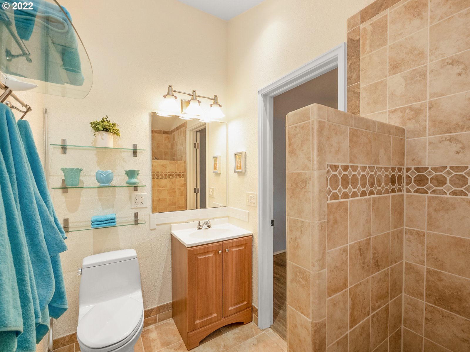 8810 Southeast Rural Street Portland, OR 97266 - Photo 24 of 32 a bathroom with a sink toilet and shower