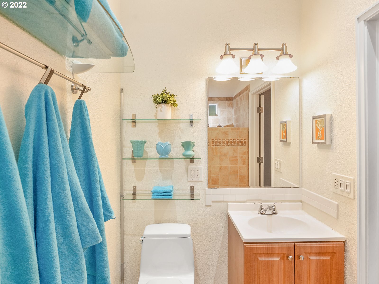 8810 Southeast Rural Street Portland, OR 97266 - Photo 25 of 32 a bathroom with a sink a mirror a vanity and a shower