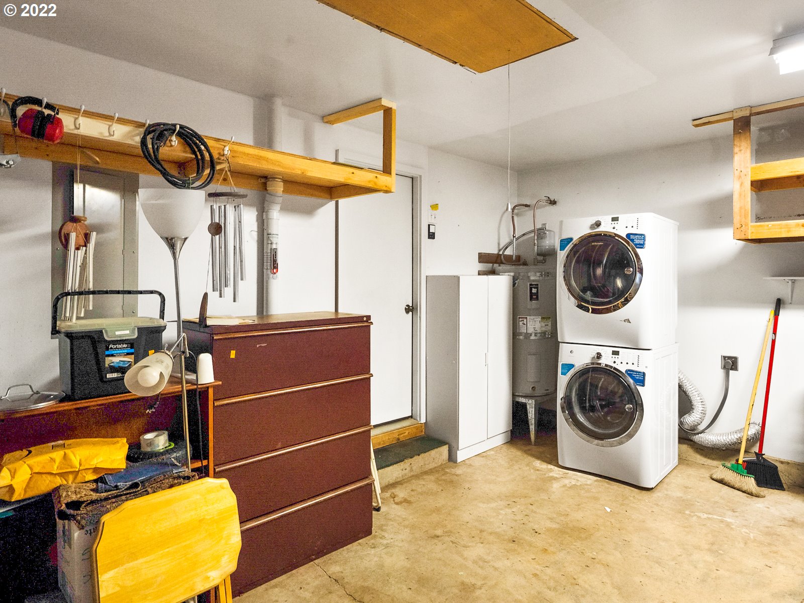 8810 Southeast Rural Street Portland, OR 97266 - Photo 26 of 32 a view of walk in closet with clothes and shoes