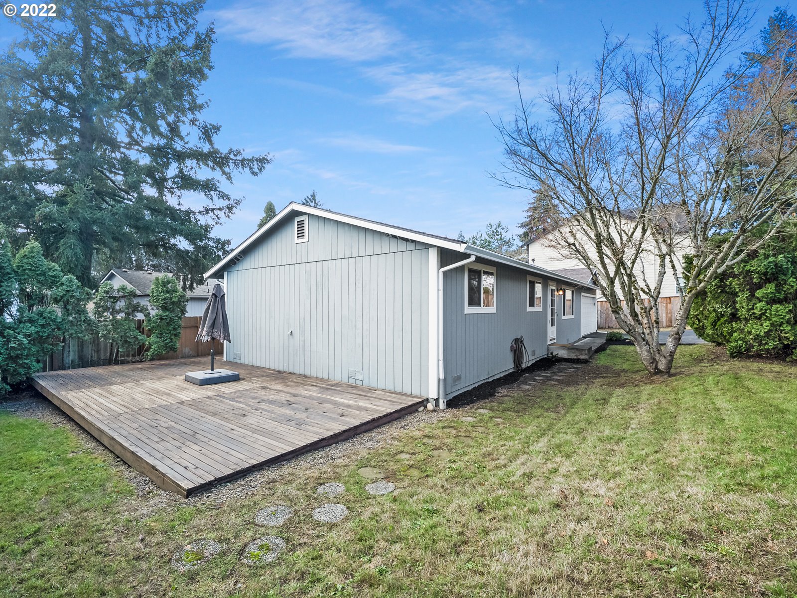 8810 Southeast Rural Street Portland, OR 97266 - Photo 27 of 32 a view of a backyard with a tree