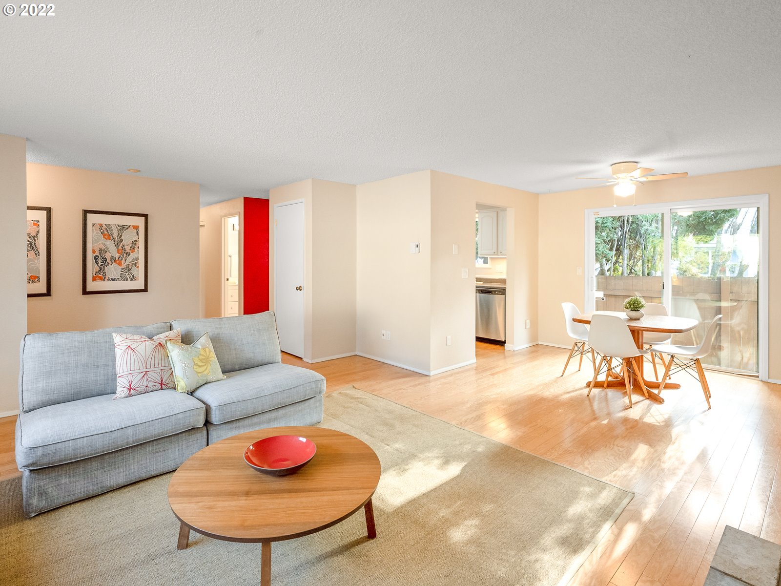 8810 Southeast Rural Street Portland, OR 97266 - Photo 5 of 32 a living room with furniture and a large window