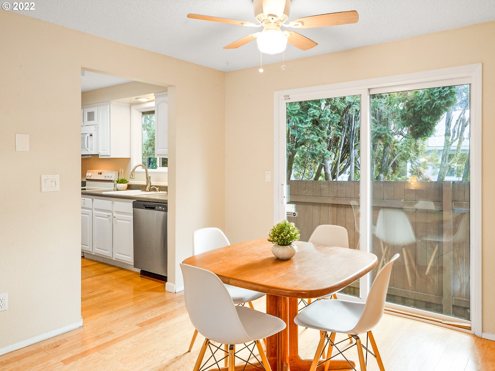 8810 Southeast Rural Street Portland, OR 97266 - Photo 6 of 32 a view of a dining room with a table and chairs
