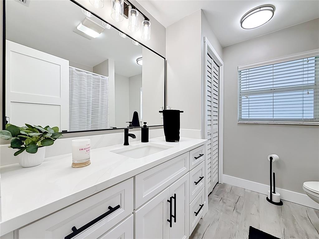 508 Shore Drive Largo, FL 33771 - Photo 19 of 31 a bathroom with a double vanity sink and a mirror
