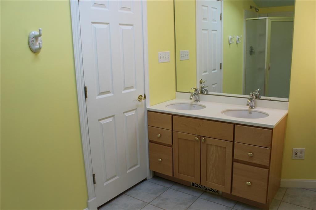 1531 Pennock Road Pittsburgh, PA 15212 - Photo 7 of 14 Master bath with maple double bowl vanity, ceramic tile floor, and skylight.
