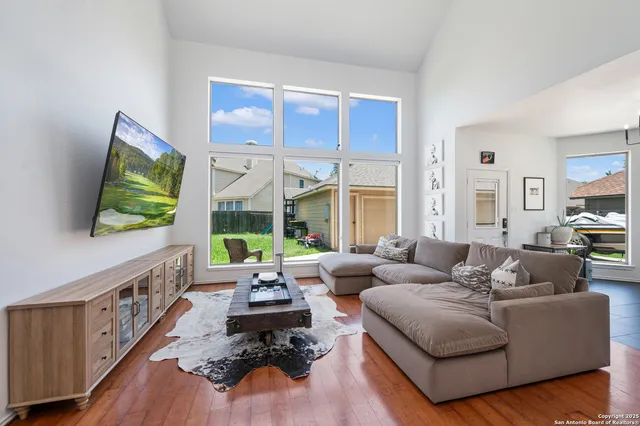 a living room with furniture and a flat screen tv