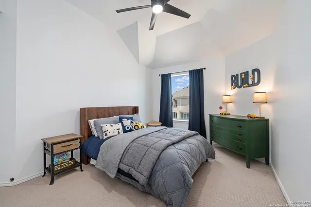 a bedroom with a bed and a dresser