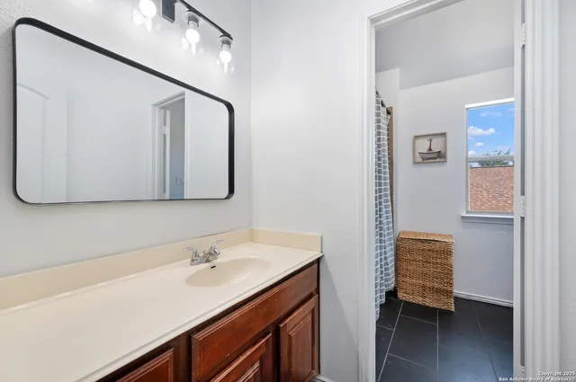 a bathroom with a sink and a mirror