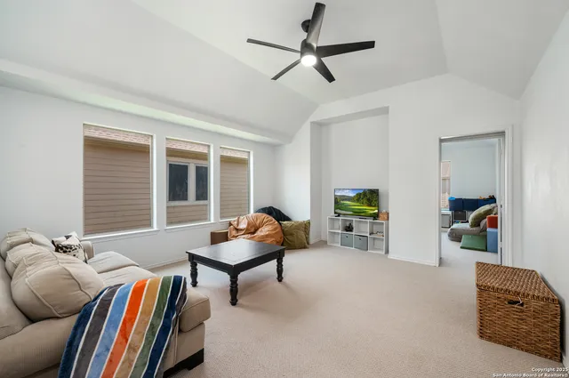 a bedroom with furniture and a window