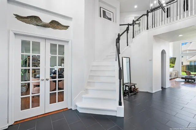 a view of staircase with white walls and windows