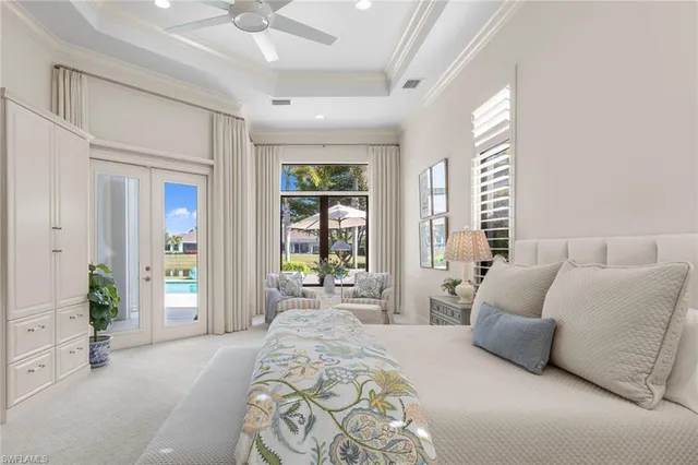 a spacious bedroom with a bed and a large window