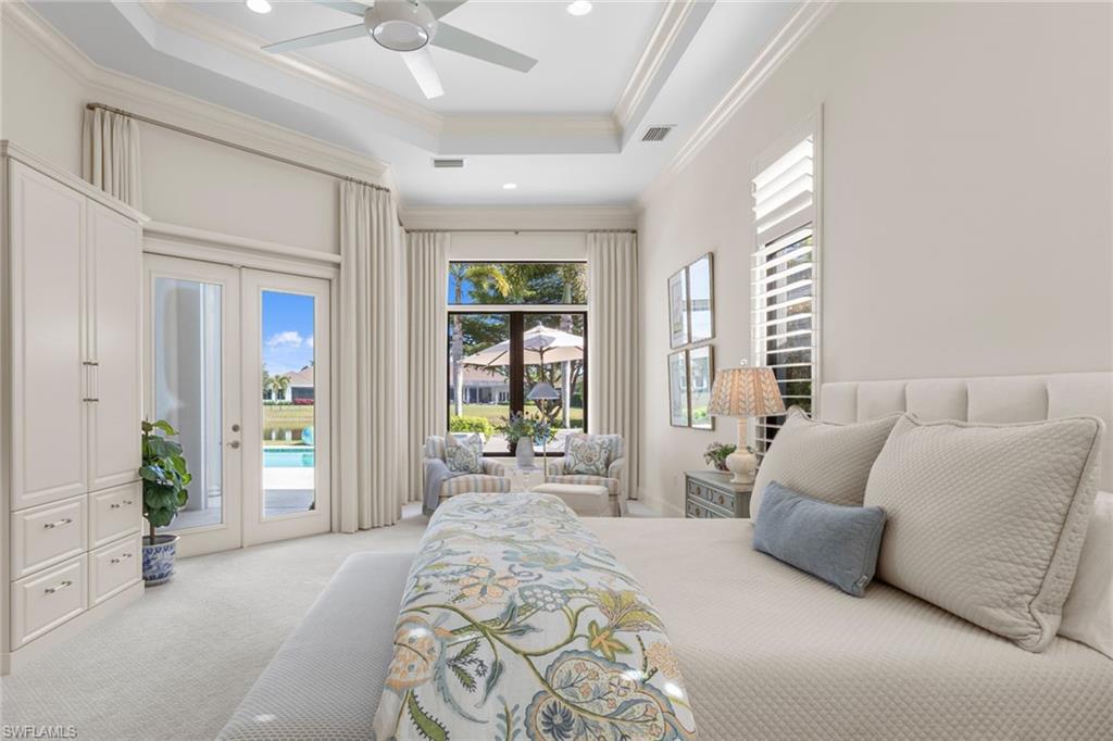 4170 Cortland Way Naples, FL 34119 - Photo 16 of 41 Carpeted bedroom featuring a tray ceiling, french doors, ceiling fan, recessed lighting, and access to outside