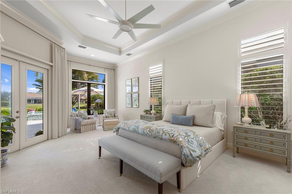 4170 Cortland Way Naples, FL 34119 - Photo 17 of 41 Bedroom with access to exterior, crown molding, a raised ceiling, a ceiling fan, and carpet