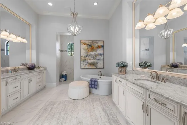 a spacious bathroom with a double vanity sink mirror and double
