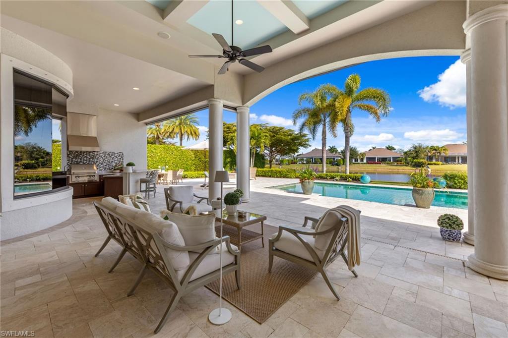 4170 Cortland Way Naples, FL 34119 - Photo 27 of 41 View of patio / terrace featuring area for grilling, ceiling fan, an outdoor pool, an outdoor hangout area, and a residential view