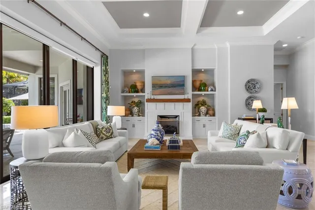 a living room with furniture fireplace and a television