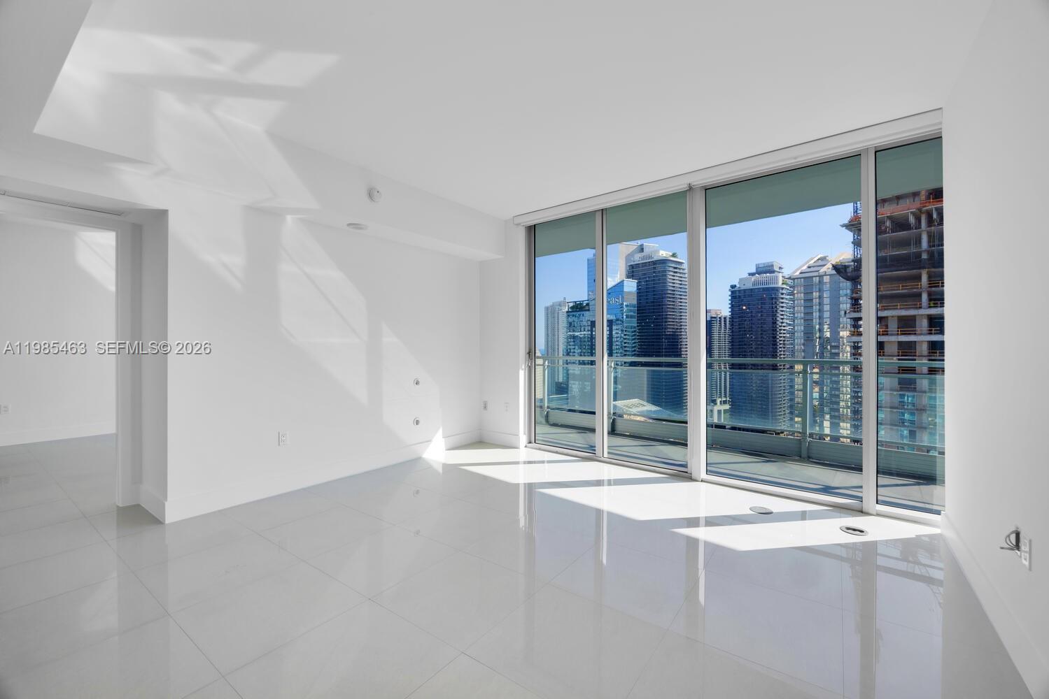 92 Southwest 3rd Street, Unit 3904 Miami, FL 33130 - Photo 3 of 30 a view of an empty room with floor to ceiling window