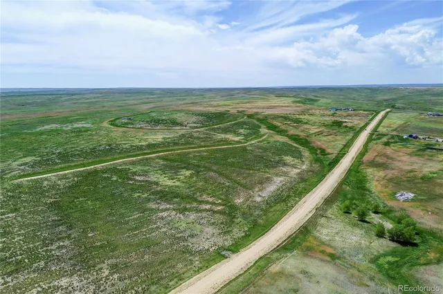 a view of an outdoor space and a lake view in back