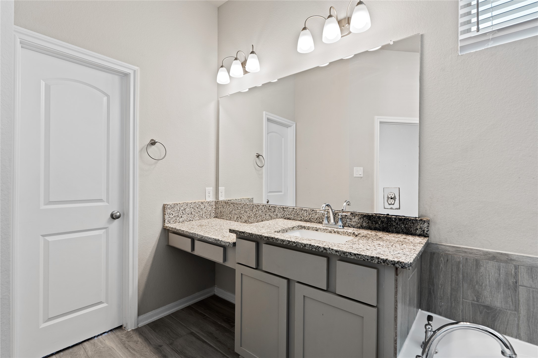 2522 Terrace Point Drive Missouri City, TX 77459 - Photo 16 of 25 a bathroom with a granite countertop sink a mirror and a vanity