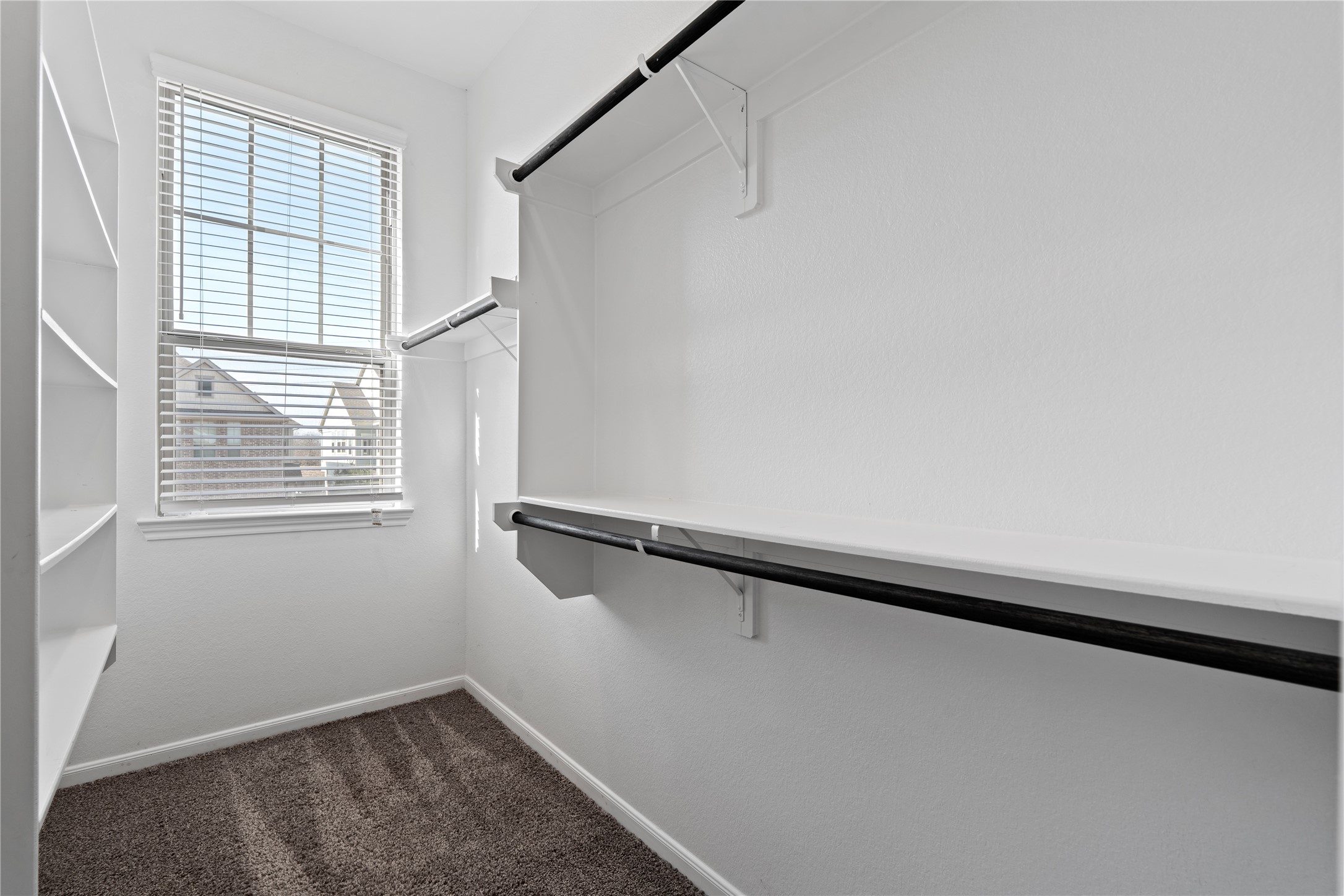 2522 Terrace Point Drive Missouri City, TX 77459 - Photo 18 of 25 a view of walk in closet with window