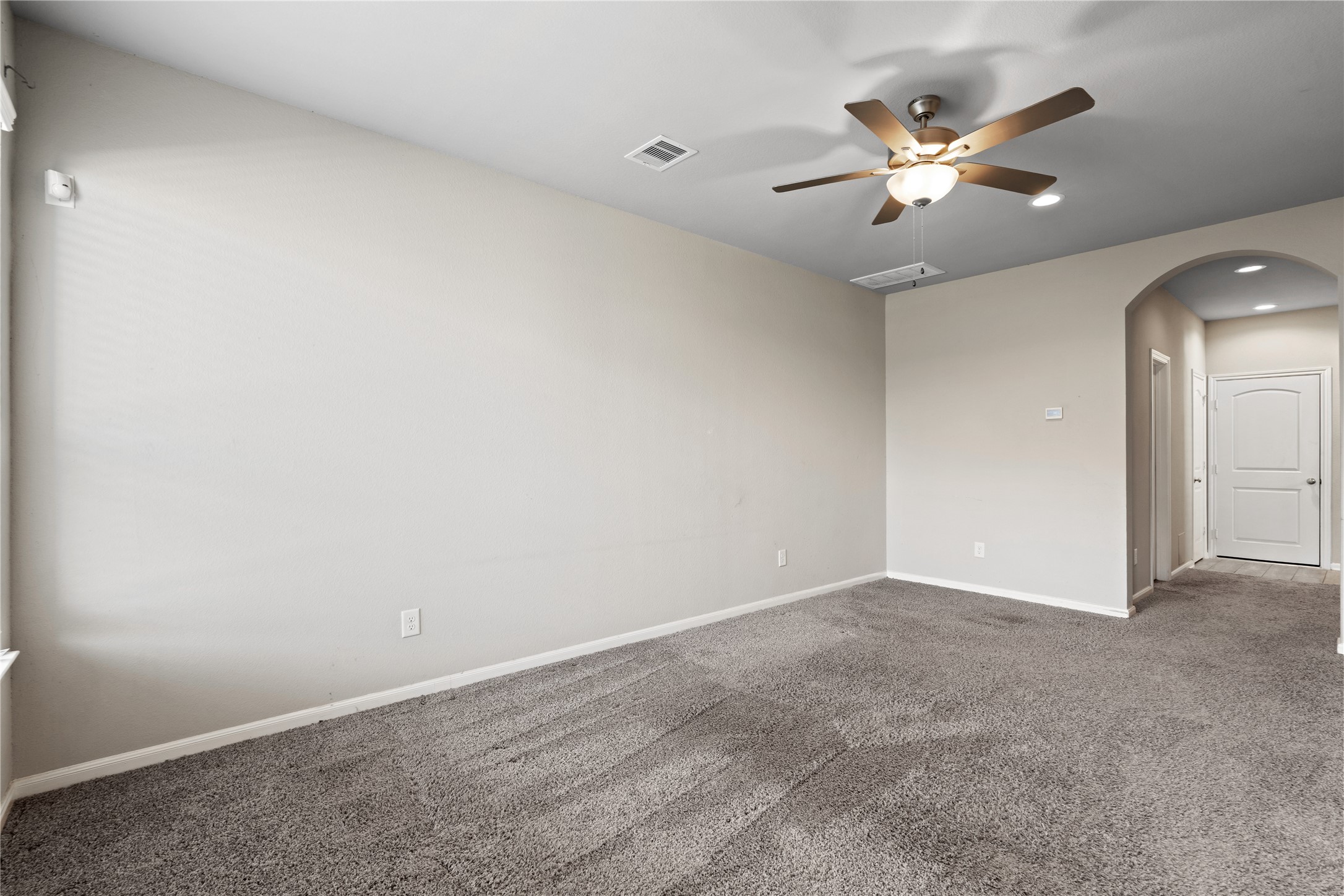 2522 Terrace Point Drive Missouri City, TX 77459 - Photo 19 of 25 an empty room with chandelier fan