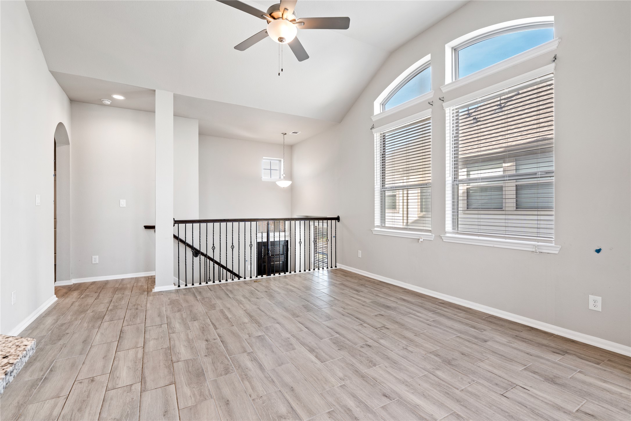 2522 Terrace Point Drive Missouri City, TX 77459 - Photo 6 of 25 a view of an empty room with a window and wooden floor