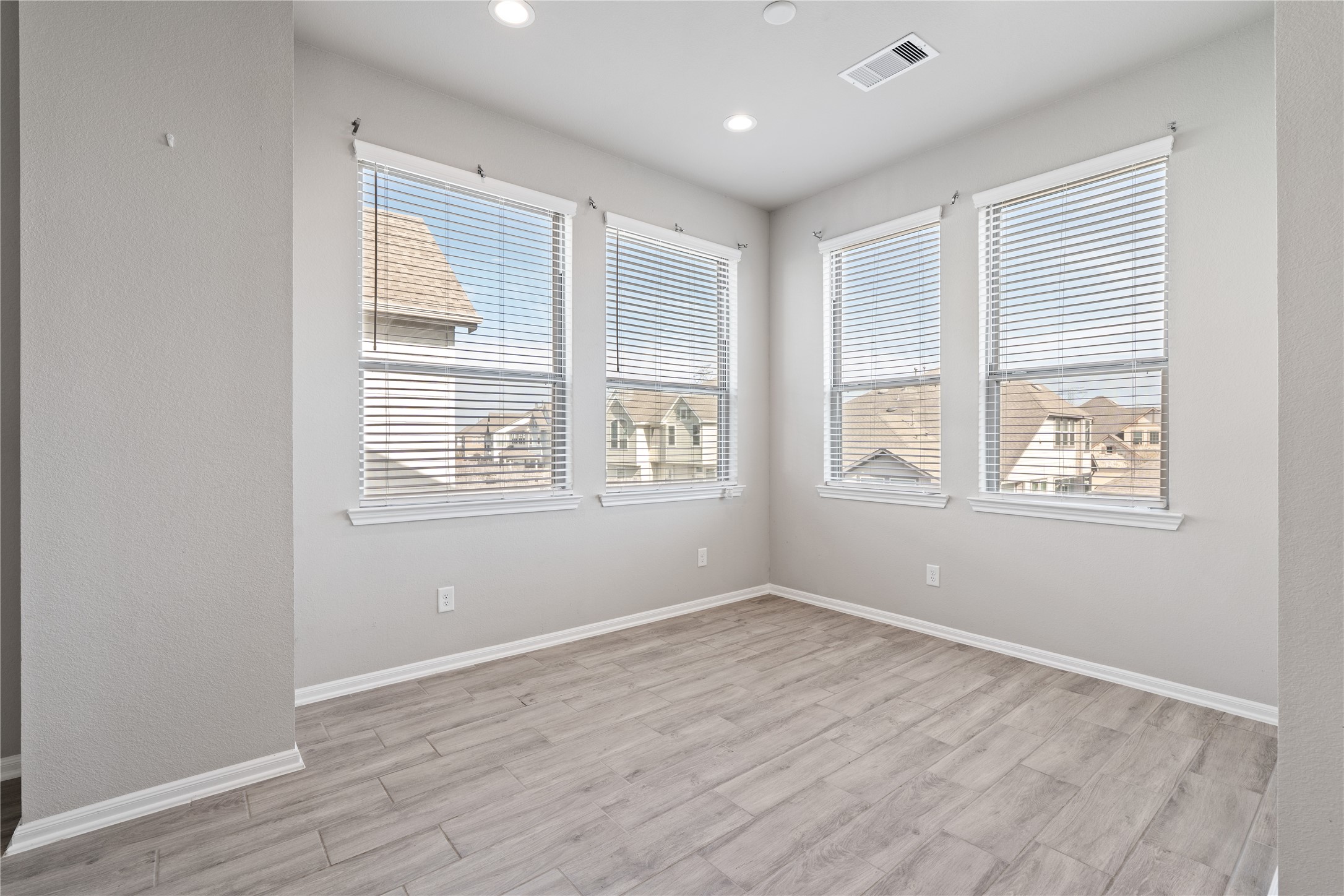 2522 Terrace Point Drive Missouri City, TX 77459 - Photo 8 of 25 a view of empty room with wooden floor and fan