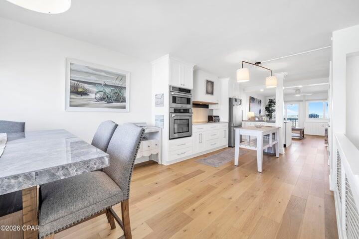 23223 Front Beach Road, Unit A1 PH10 Panama City Beach, FL 32413 - Photo 11 of 32 a living room with furniture and a table