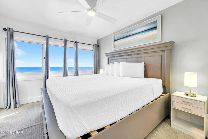 23223 Front Beach Road, Unit A1 PH10 Panama City Beach, FL 32413 - Photo 21 of 32 a large white bed in a white room