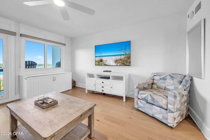 23223 Front Beach Road, Unit A1 PH10 Panama City Beach, FL 32413 - Photo 3 of 32 a living room with furniture and a flat screen tv