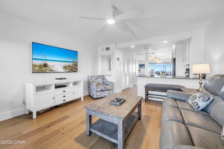 23223 Front Beach Road, Unit A1 PH10 Panama City Beach, FL 32413 - Photo 5 of 32 a living room with furniture and a flat screen tv
