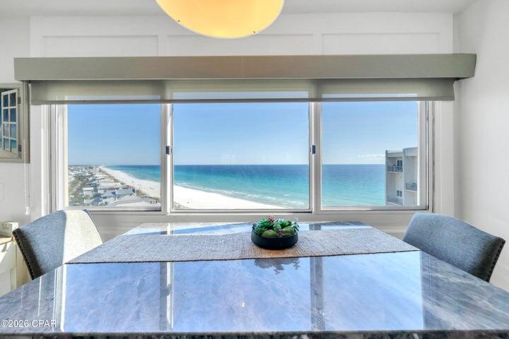 23223 Front Beach Road, Unit A1 PH10 Panama City Beach, FL 32413 - Photo 8 of 32 a living room with table and chair