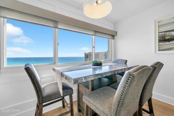 23223 Front Beach Road, Unit A1 PH10 Panama City Beach, FL 32413 - Photo 9 of 32 a view of a dining room with furniture and window